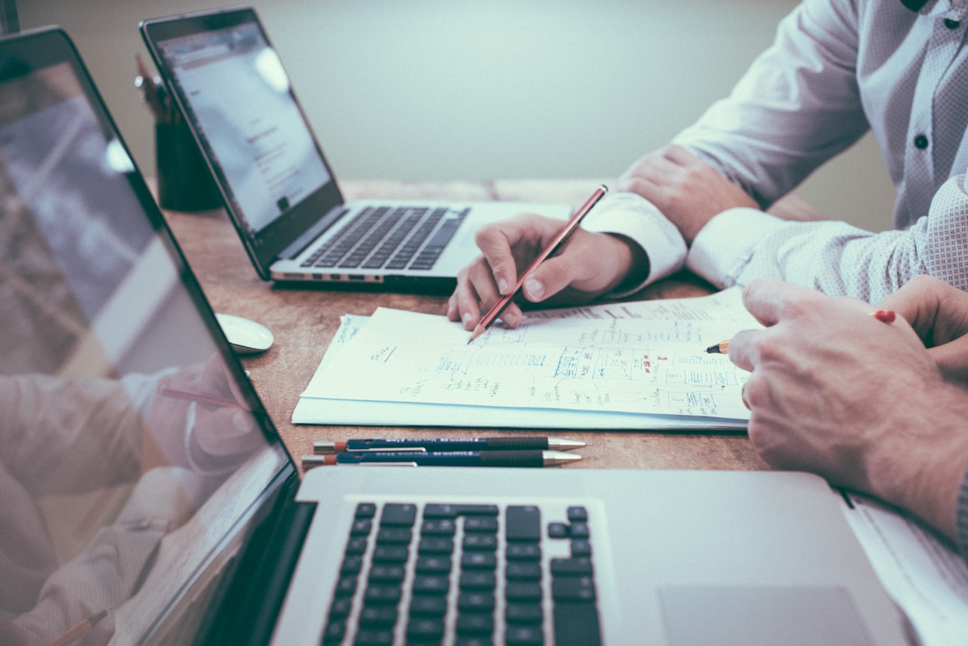 Advisor and client reviewing documents during a financial planning meeting